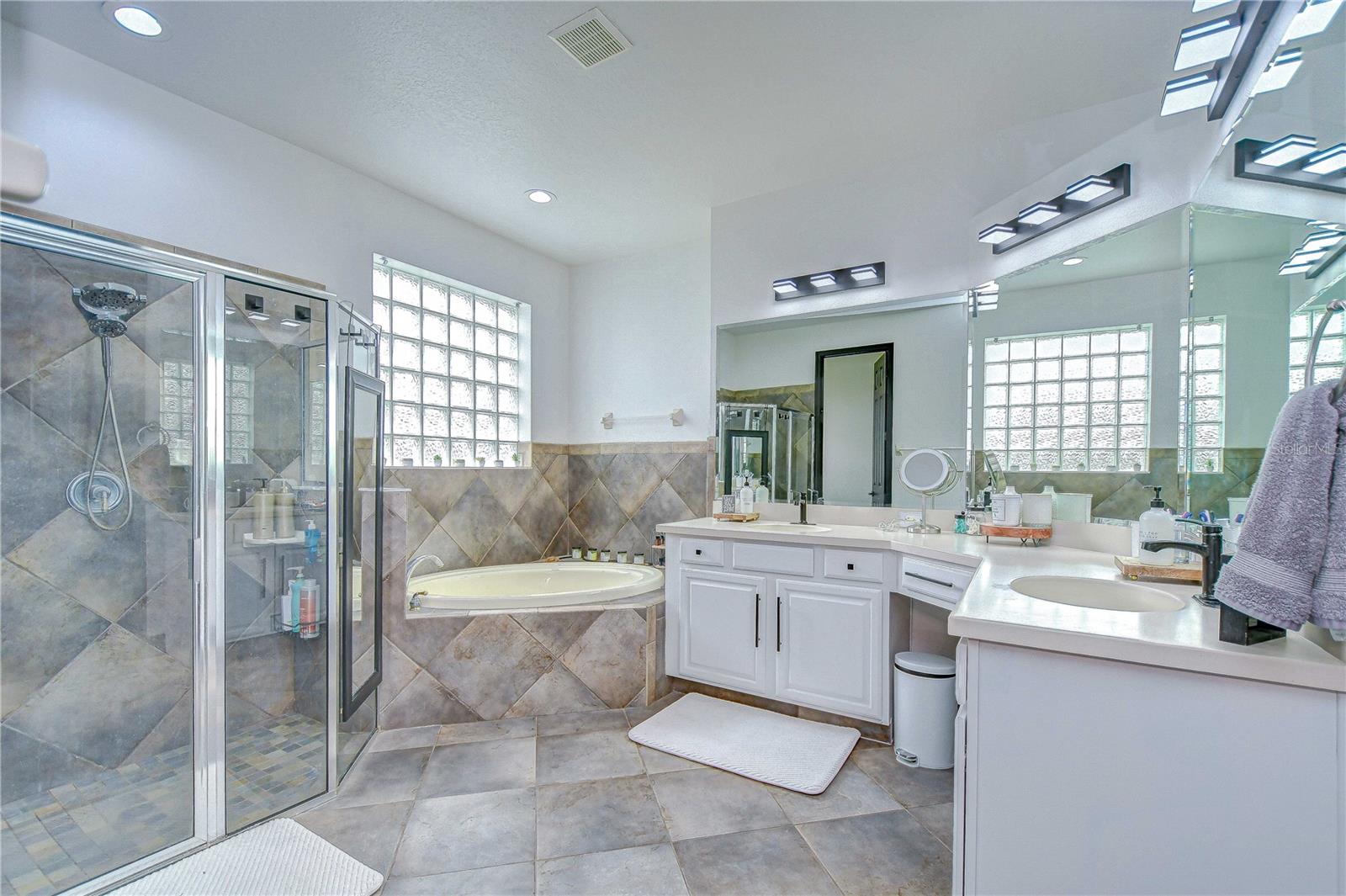 En-suite bathroom features two sinks, jetted tub, and walk-in shower!