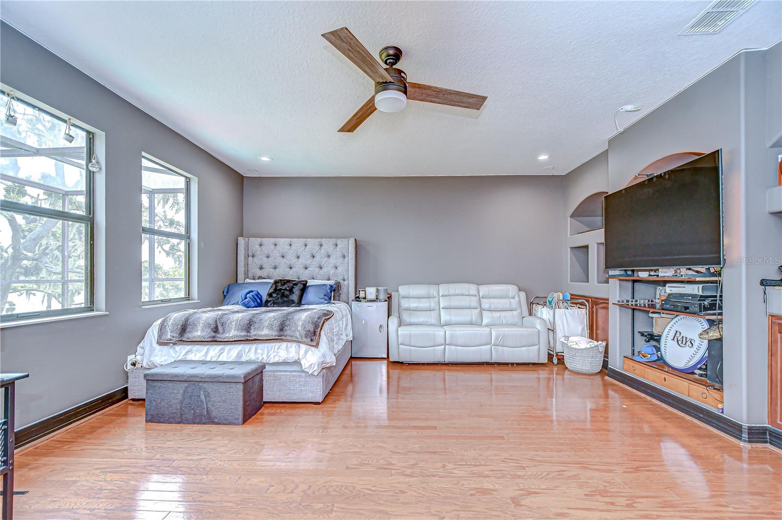 Media room offers oh so much space with pool & lake views and direct access to the balcony that you share with one bedroom!