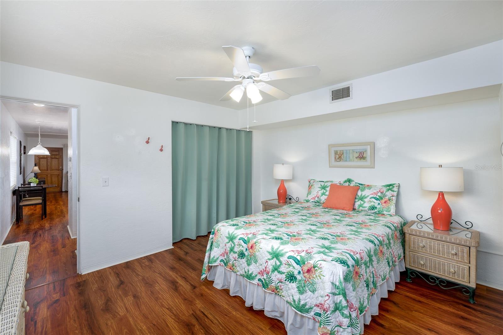 This bright and breezy bedroom connects directly to the main living space and includes soft, neutral walls ready for your personal touch.