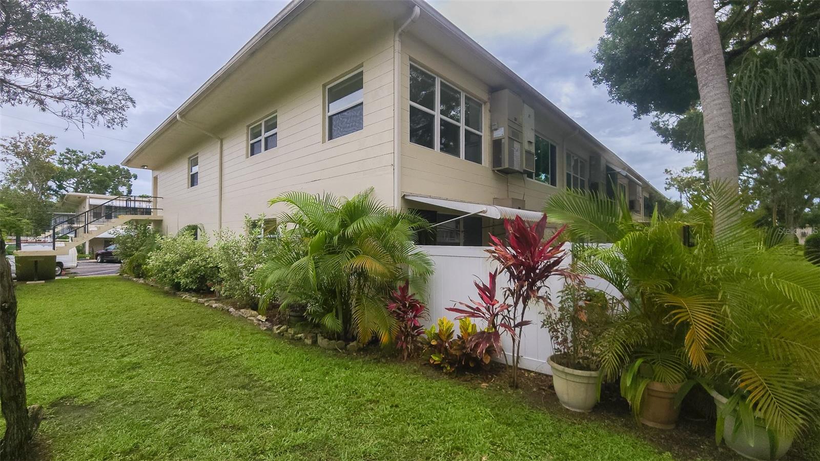 The rear patio offers two vinyl privacy fences and landscaping.