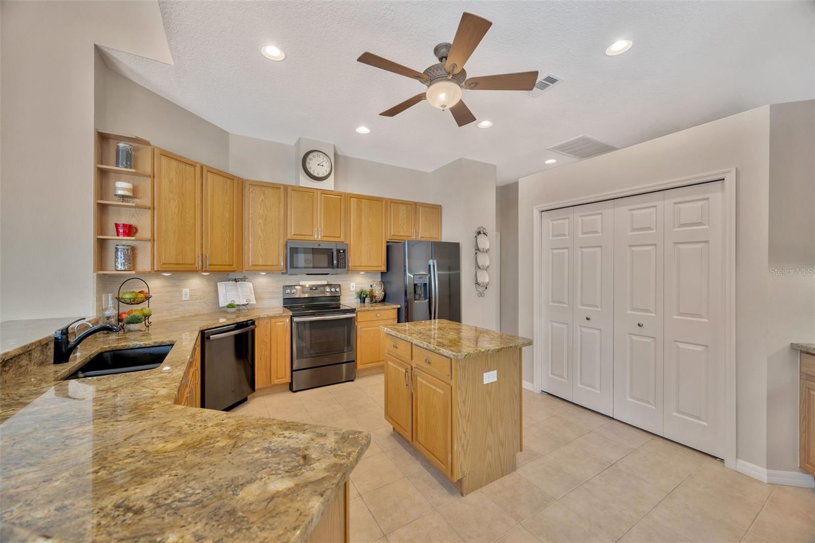 Upgraded kitchen overlooking the pool and family room.