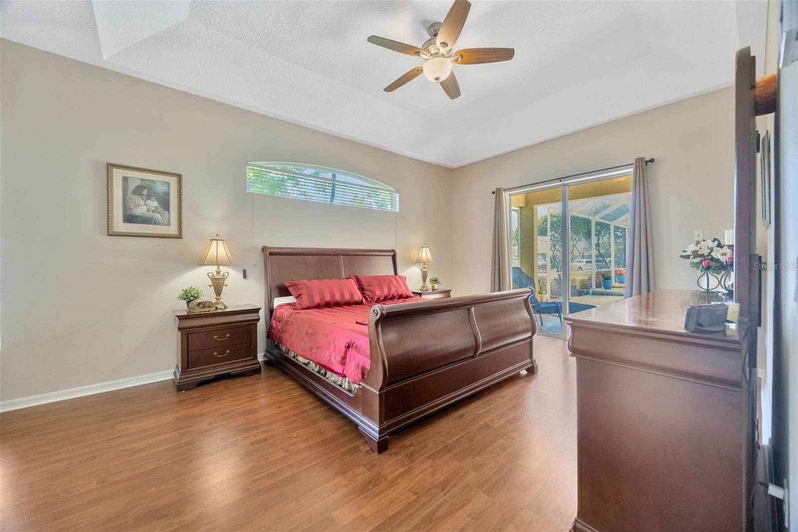 Primary Ensuite featuring upgraded bathroom, walk-in closet, and access to the lanai!