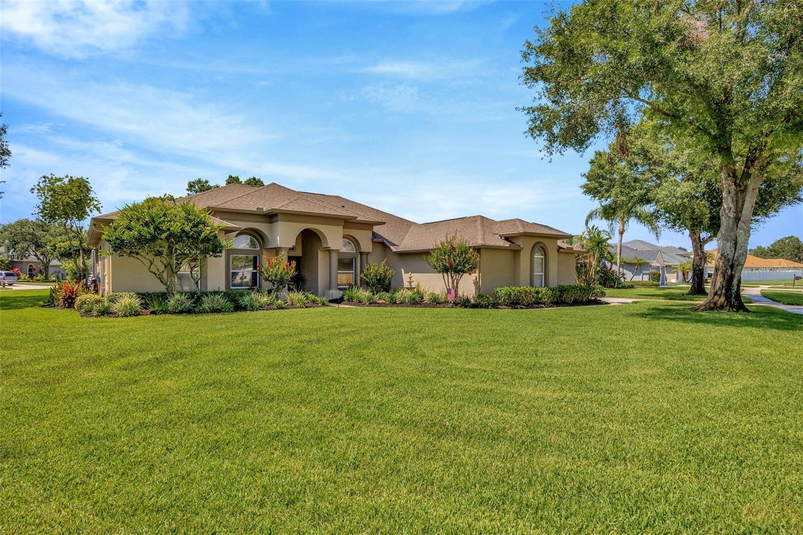 Huge Corner Lot w/ Meticulously Maintained & Lush Landscaping All Around!