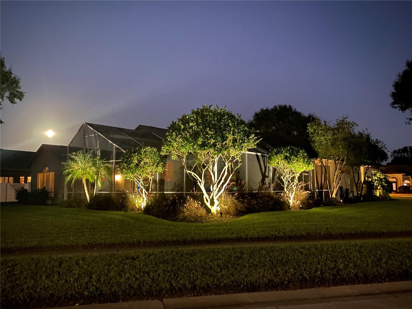 The property shines at night with gorgeous uplighting!