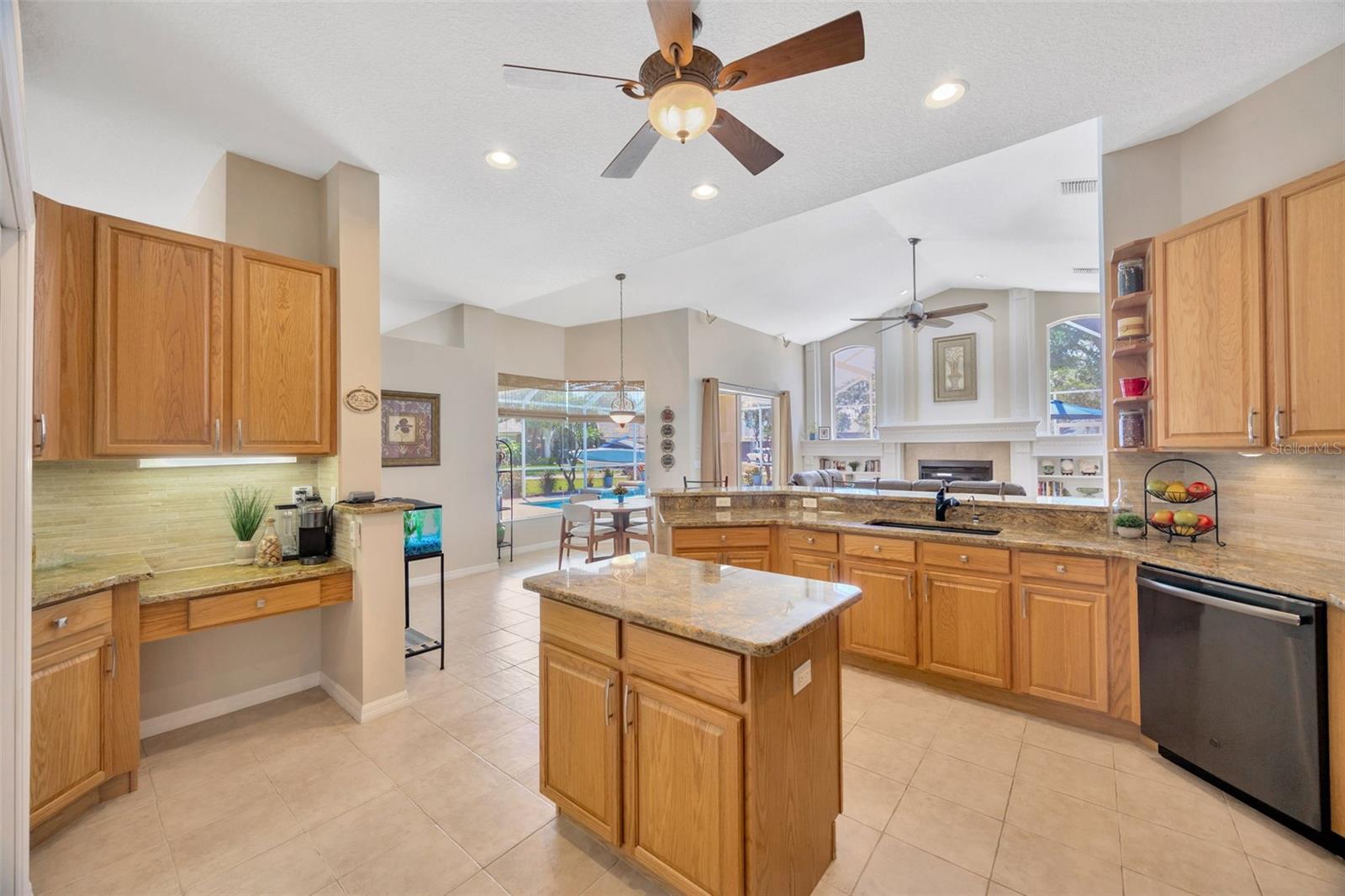 Upgraded kitchen overlooking the pool and family room.