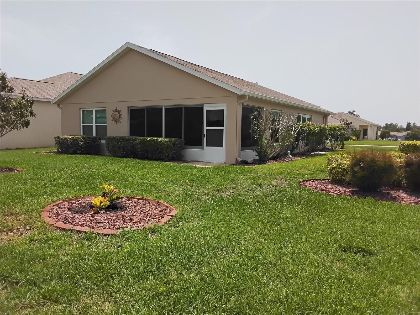 Back yard view of Florida room