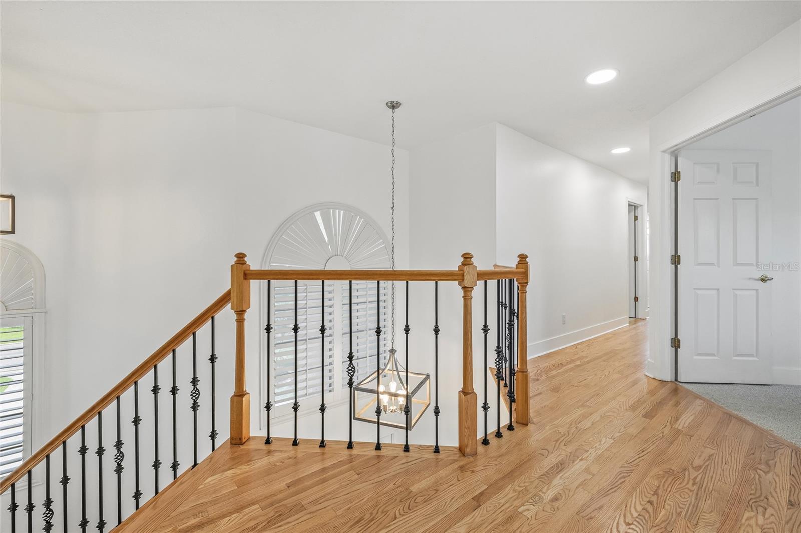 Travel upstairs to the primary suite plus 3 additional bedrooms.