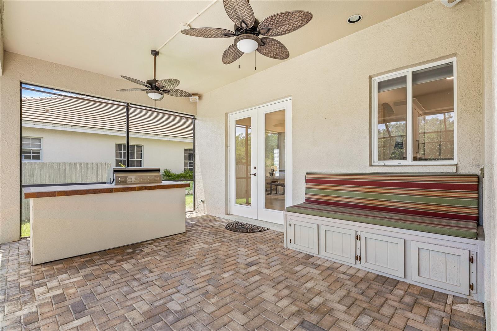 Storage bench to stow pool toys and outdoor dining items.