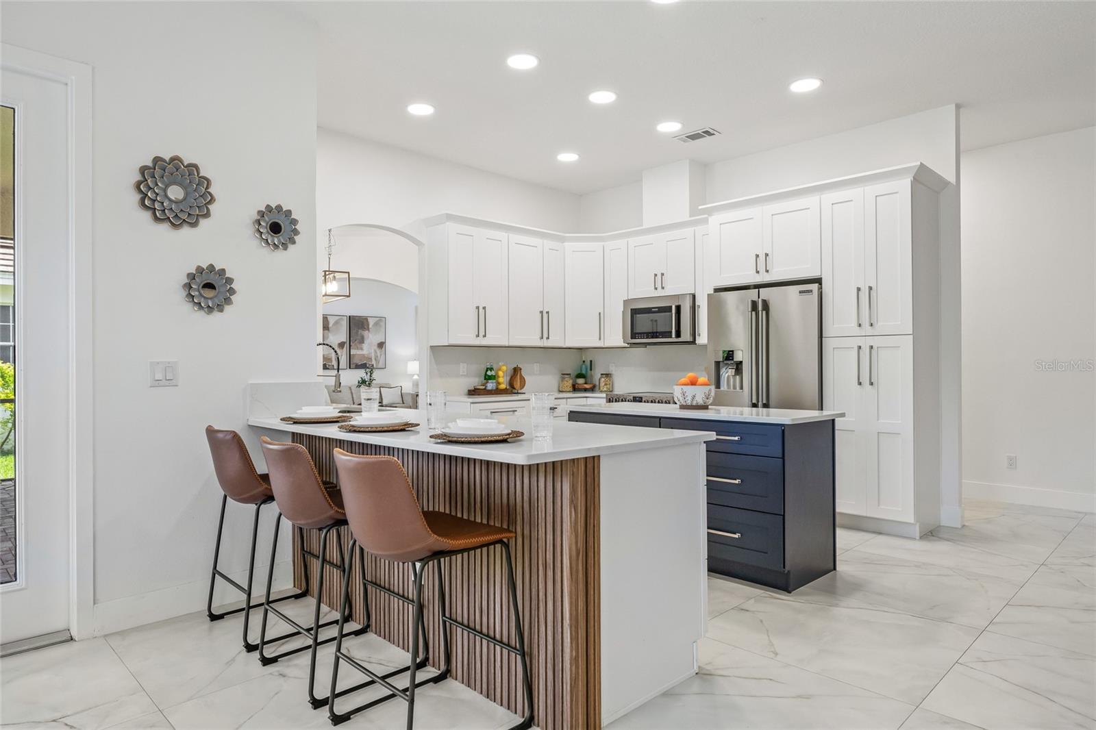 Breakfast bar and a spacious dinette behind the bar.