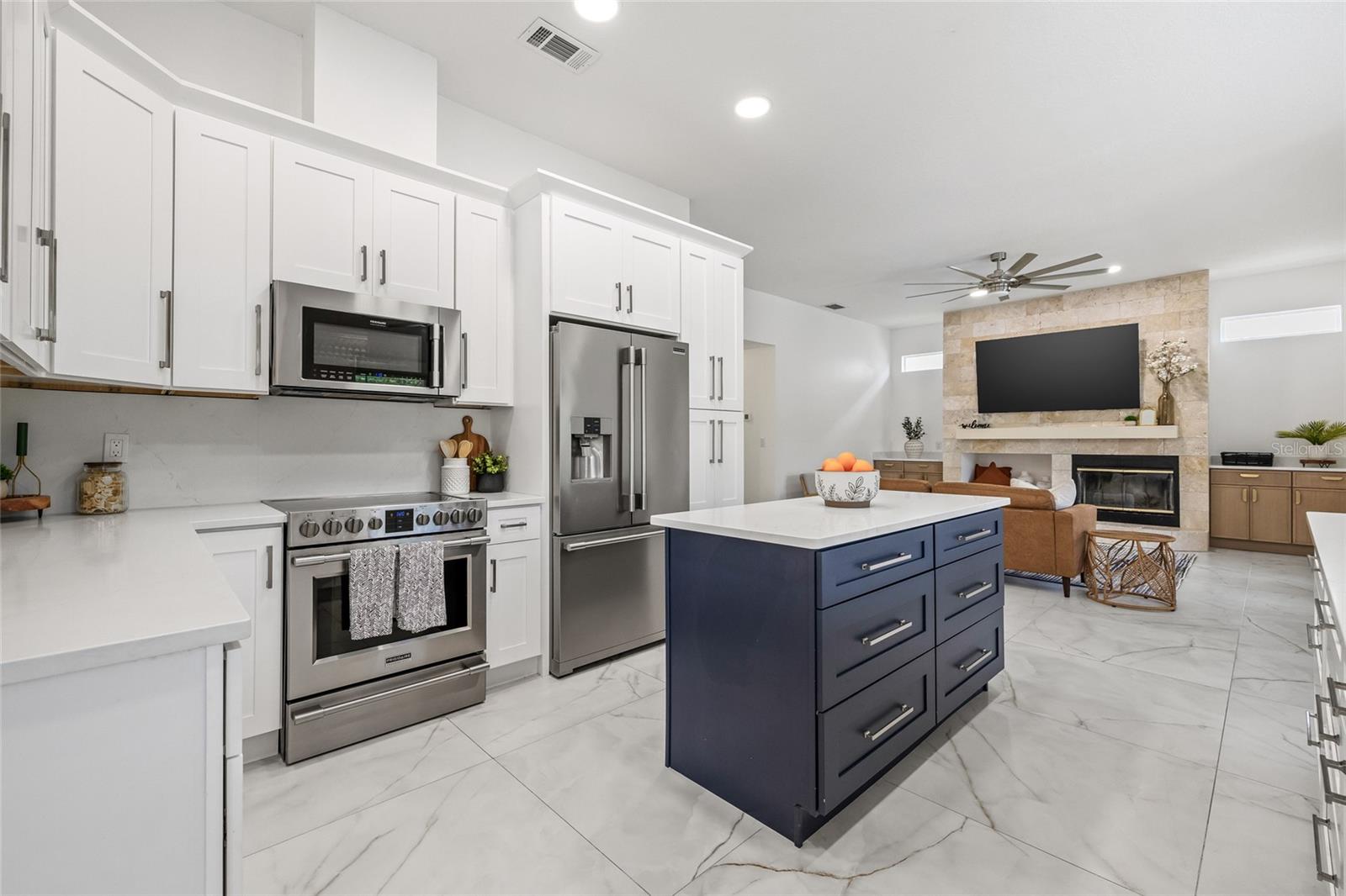 Cooking island, updated cabinetry and appliances.