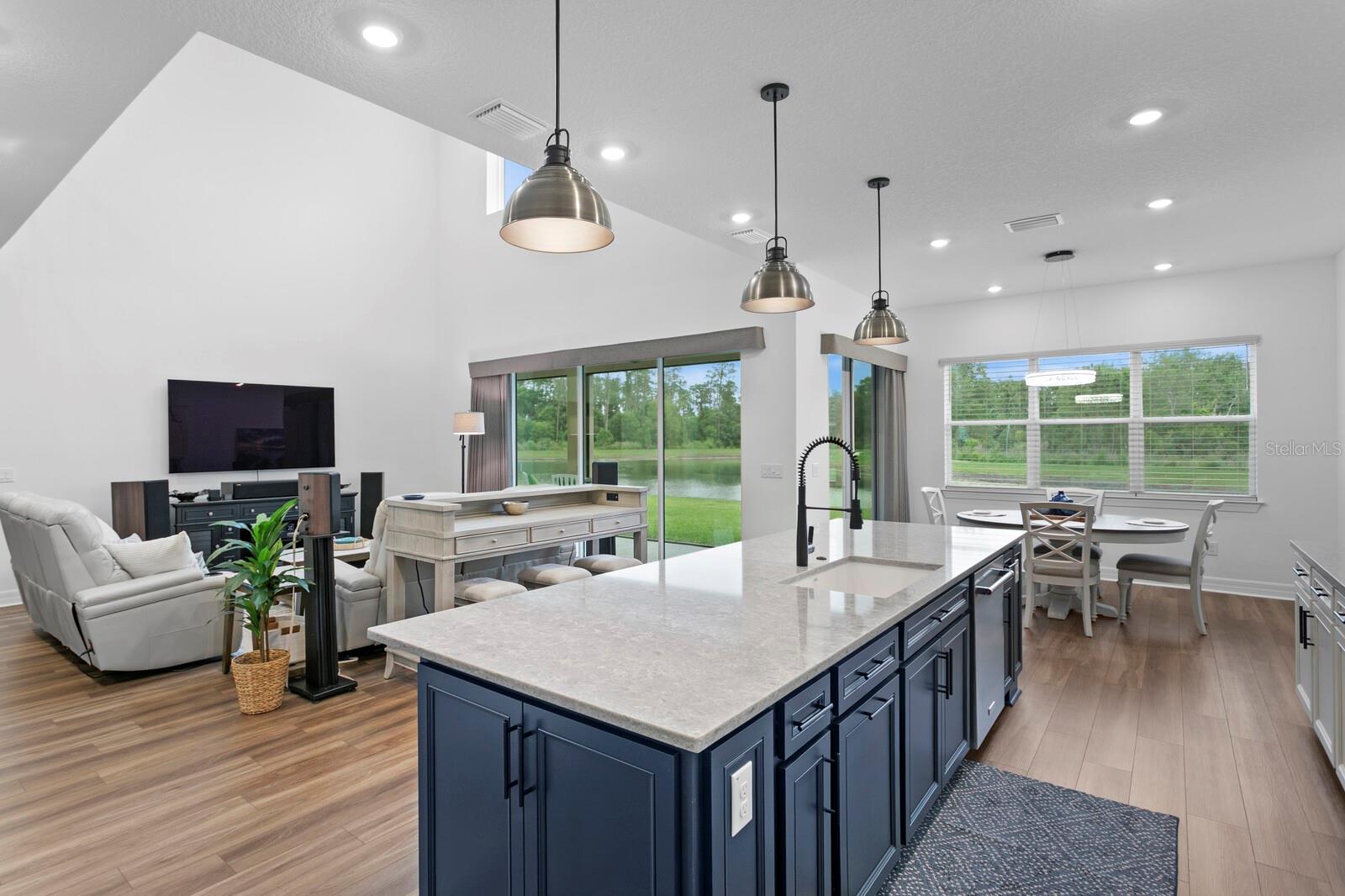 Kitchen looking back to the gathering room and to the pond and walking trails.
