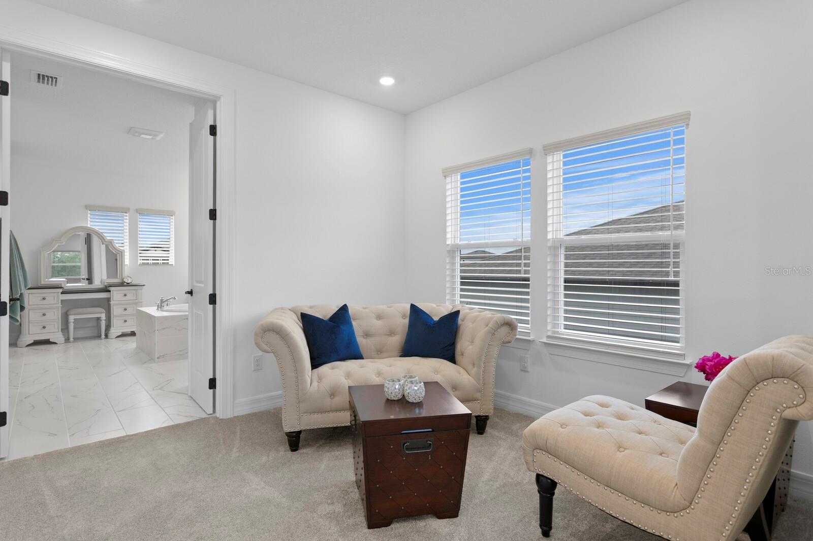 Sitting area looking into the primary bath