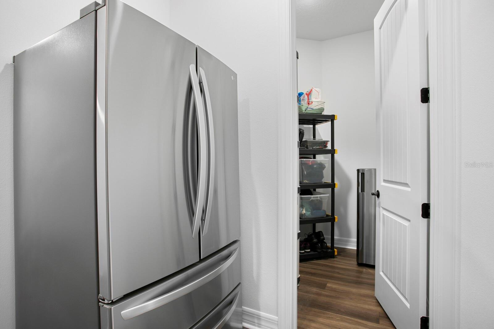 Extra refrigeration and storage by garage entrance