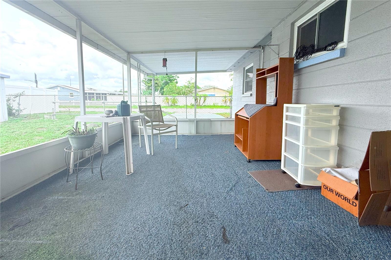 SCREENED LANAI WITH ACCESS TO BACK YARD