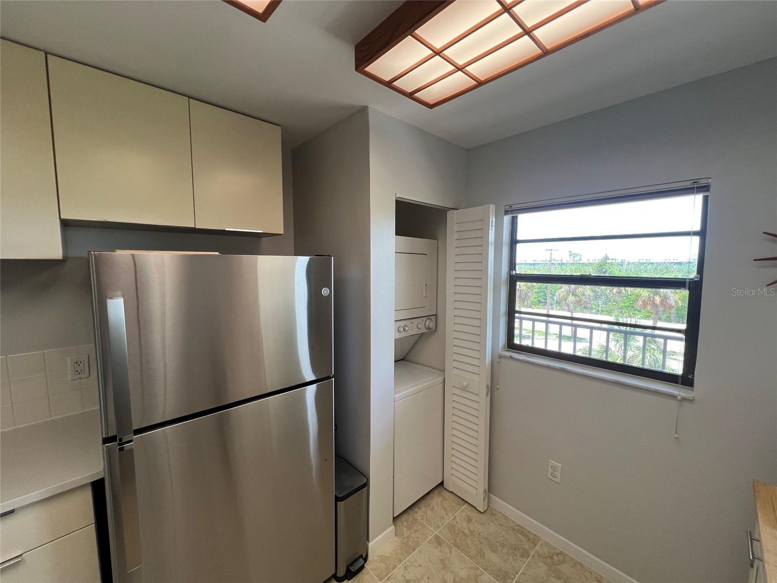 ... Spacious 11' x 13' Kitchen Looking out Towards Living Room.