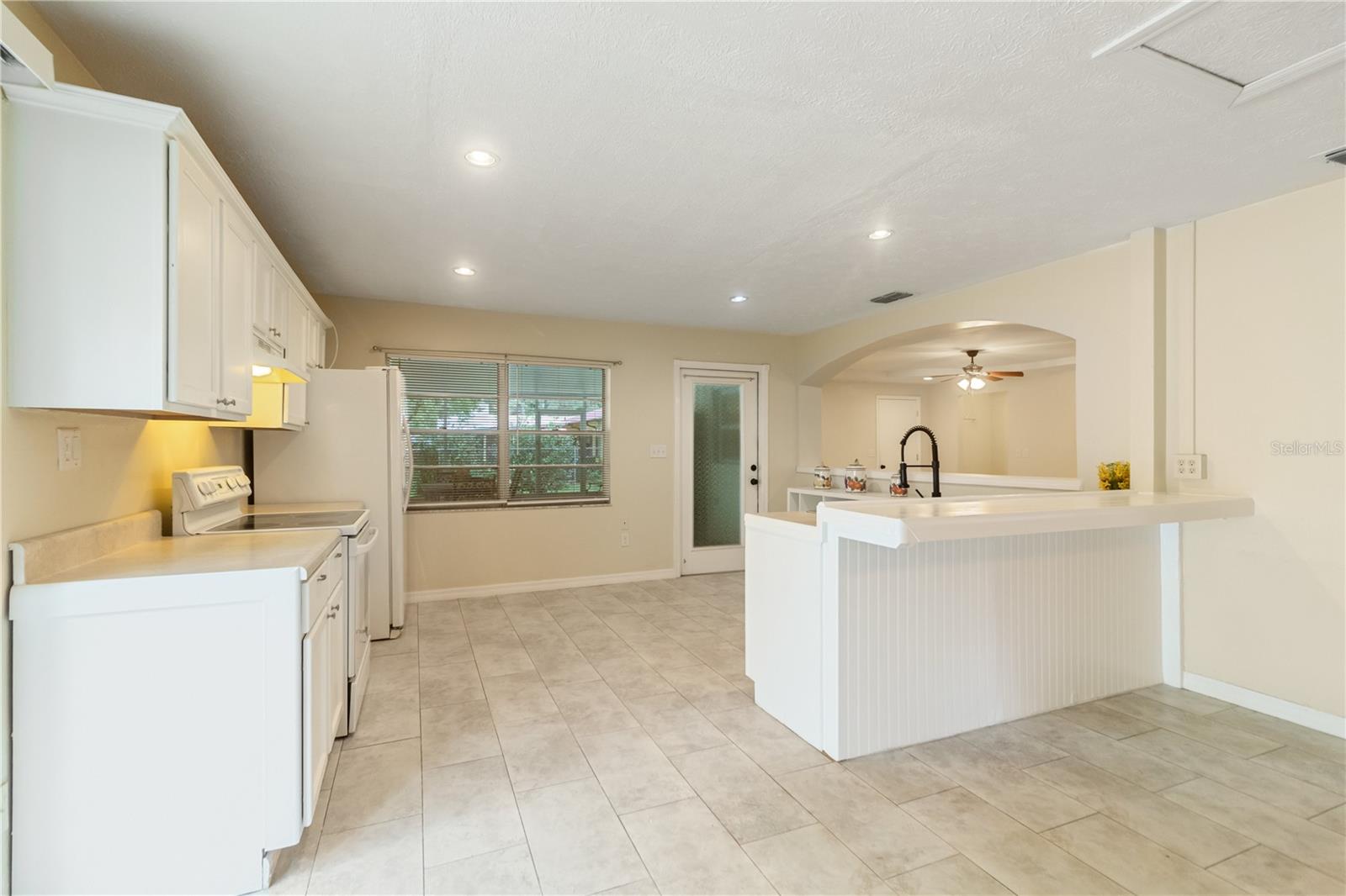 Through the kitchen leads out to your covered lanai
