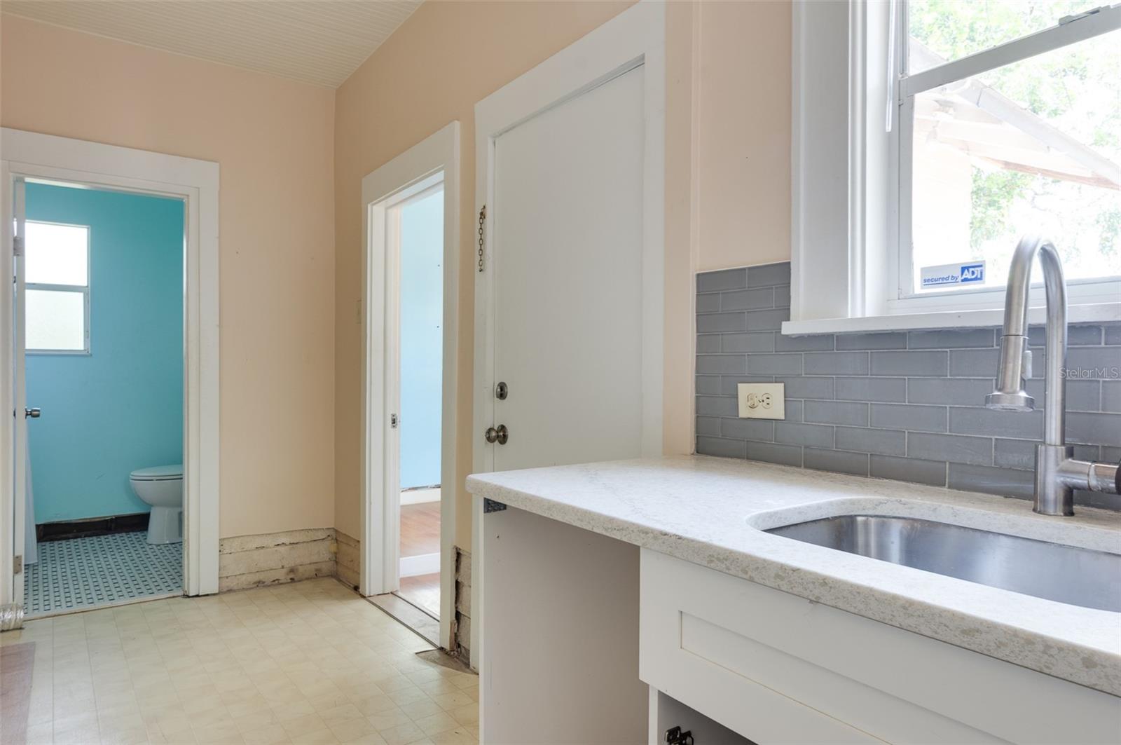 Another kitchen view, inside the laundry next to the bathroom.
