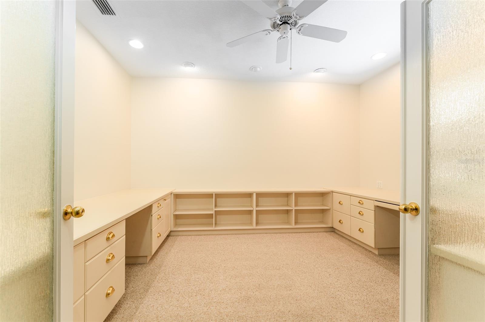 Office/Den is off the foyer to the right with double french doors