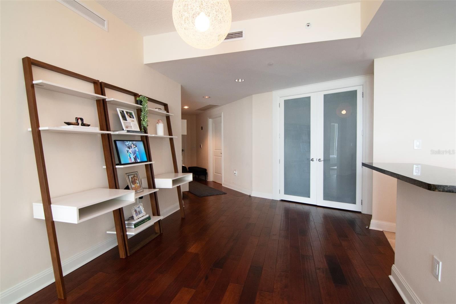 French doors lead to 2nd bedroom/den/office
