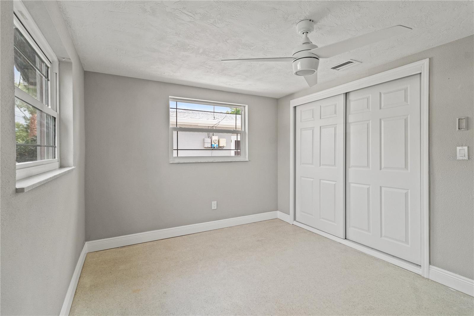 Bedroom 2 with poured terrazzo floors