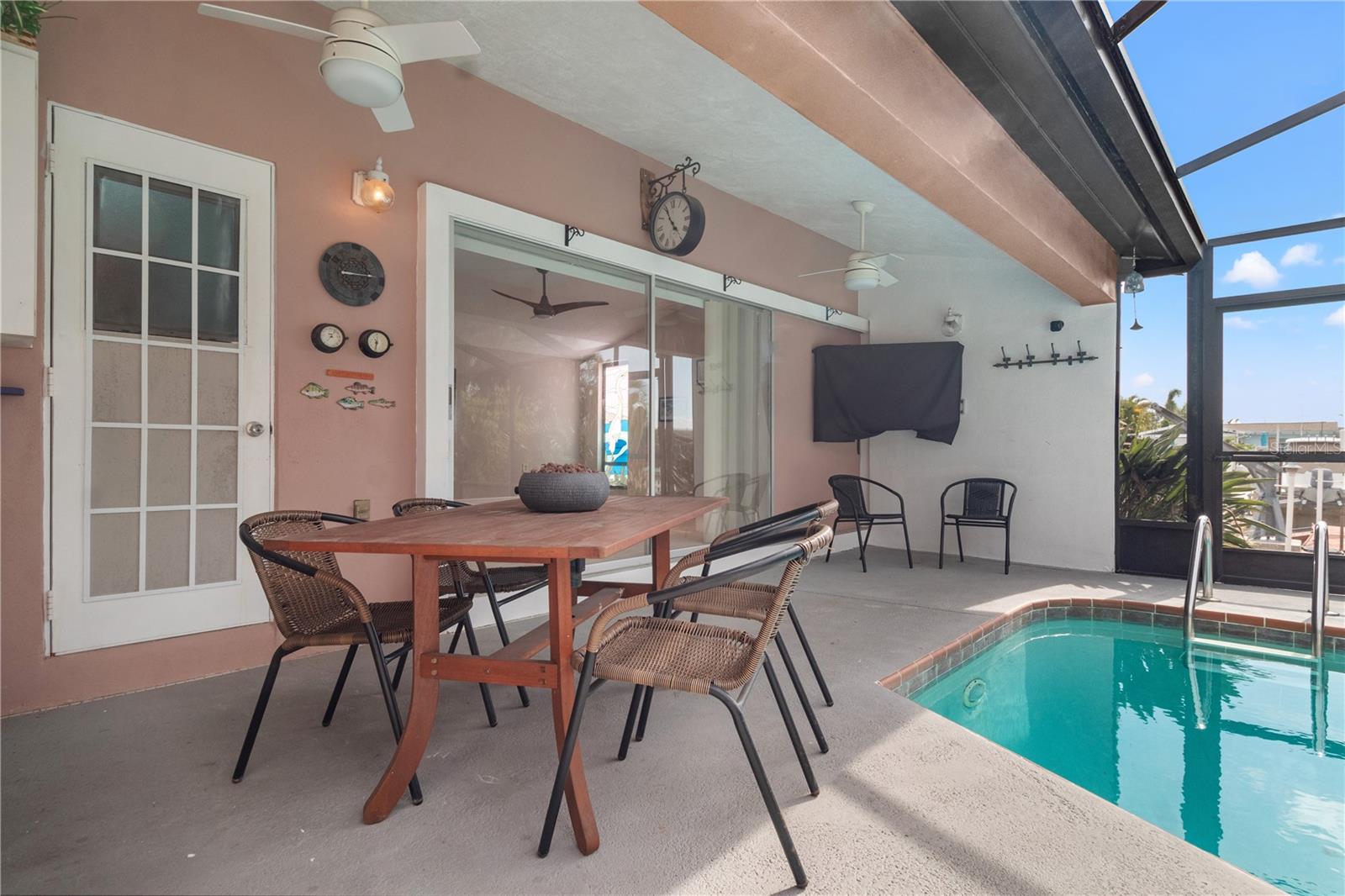 Enter the pool area through the living room or owners' suite