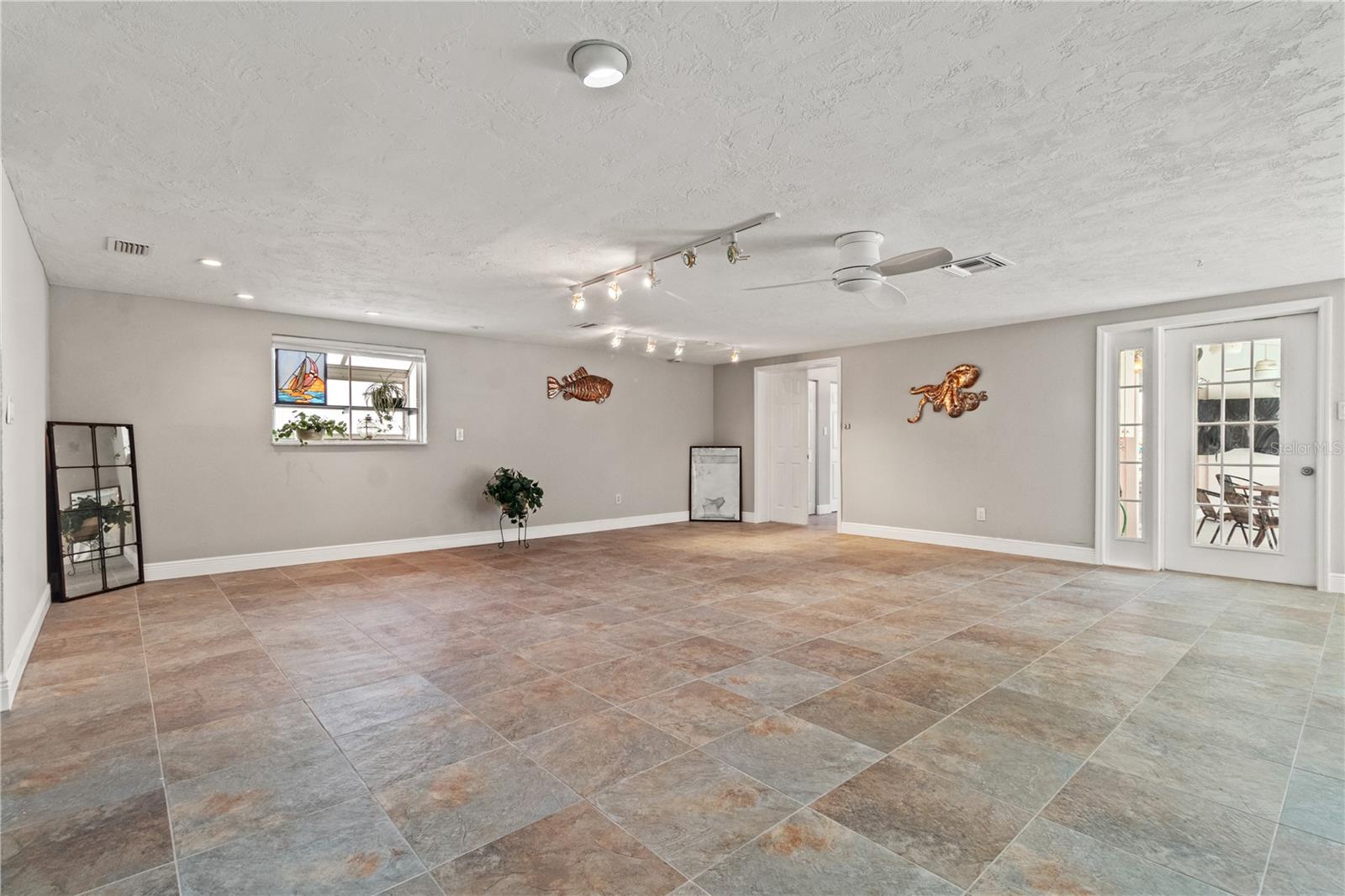 The large, open living area as viewed from the front door front door