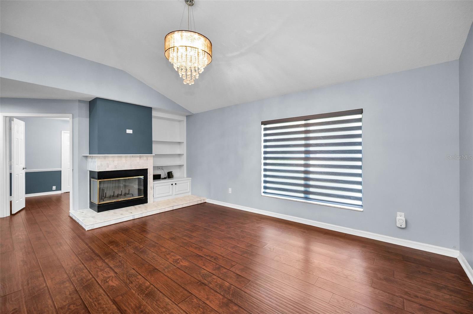 Family room with wood burning fireplace