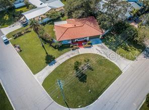 This property is NON-WATERFRONT with a large corner lot