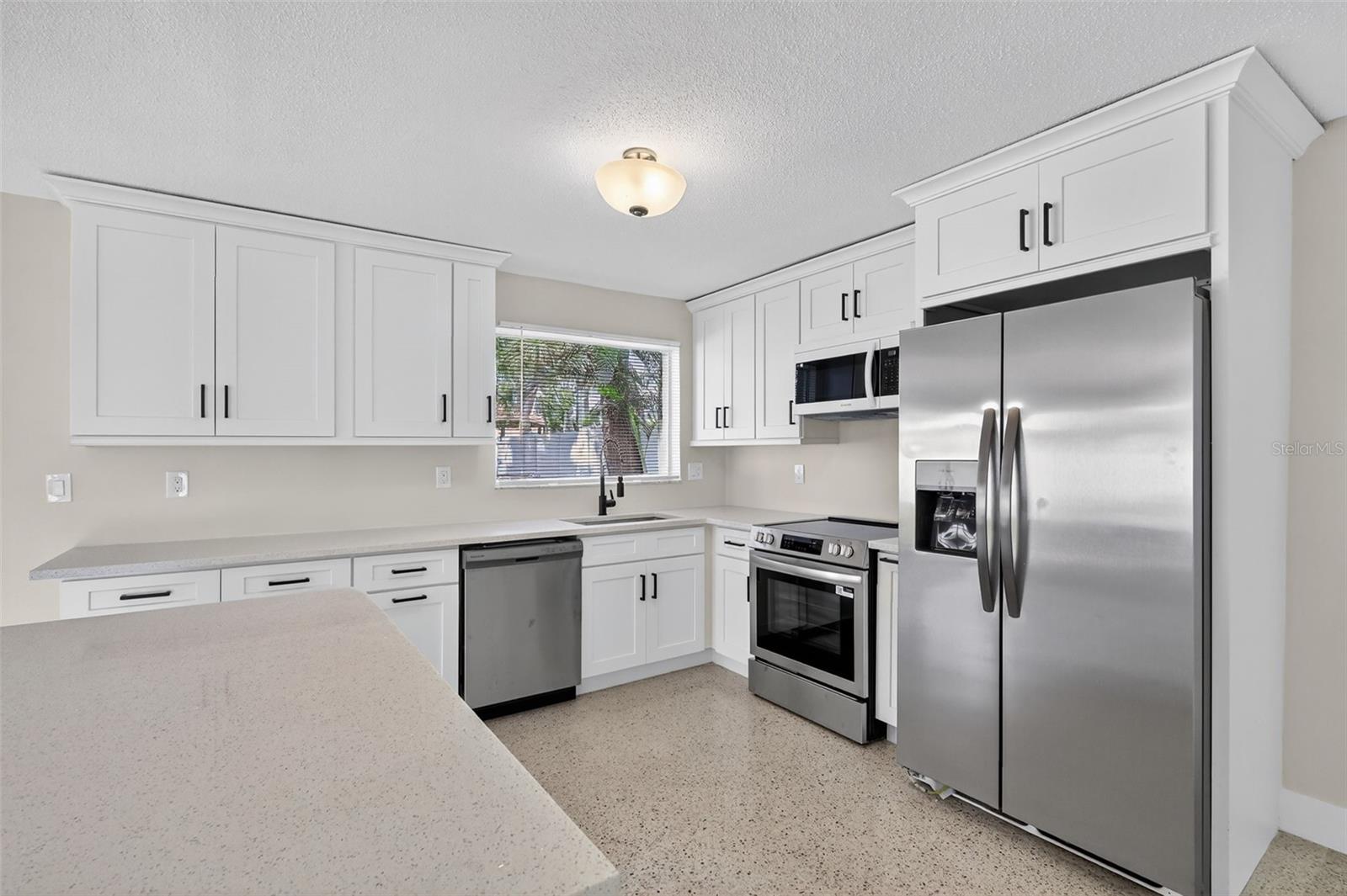 The new has plenty of cabnet space with new stainless appliances