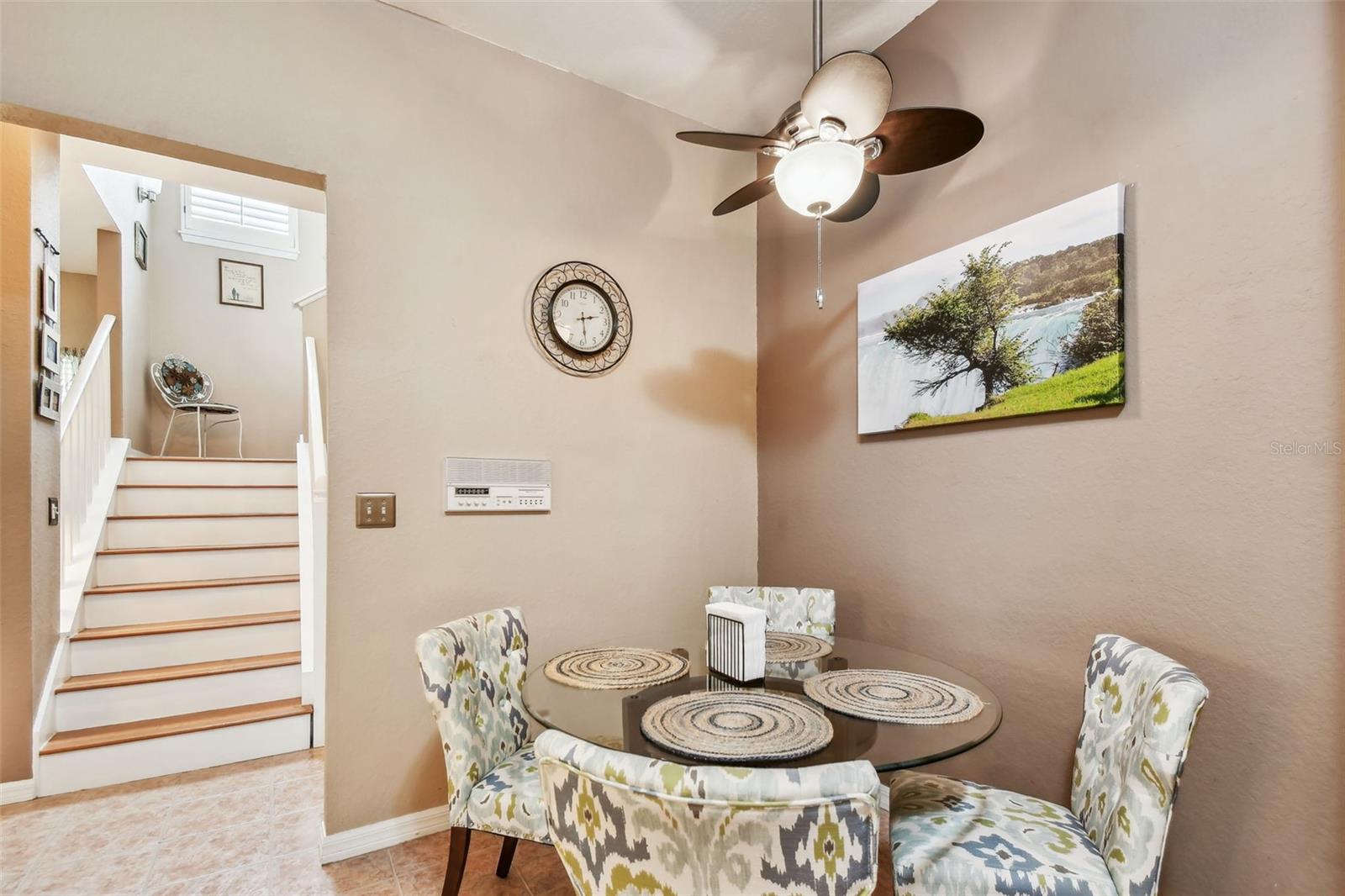 Dining area in kitchen adjacent to the entry hall.