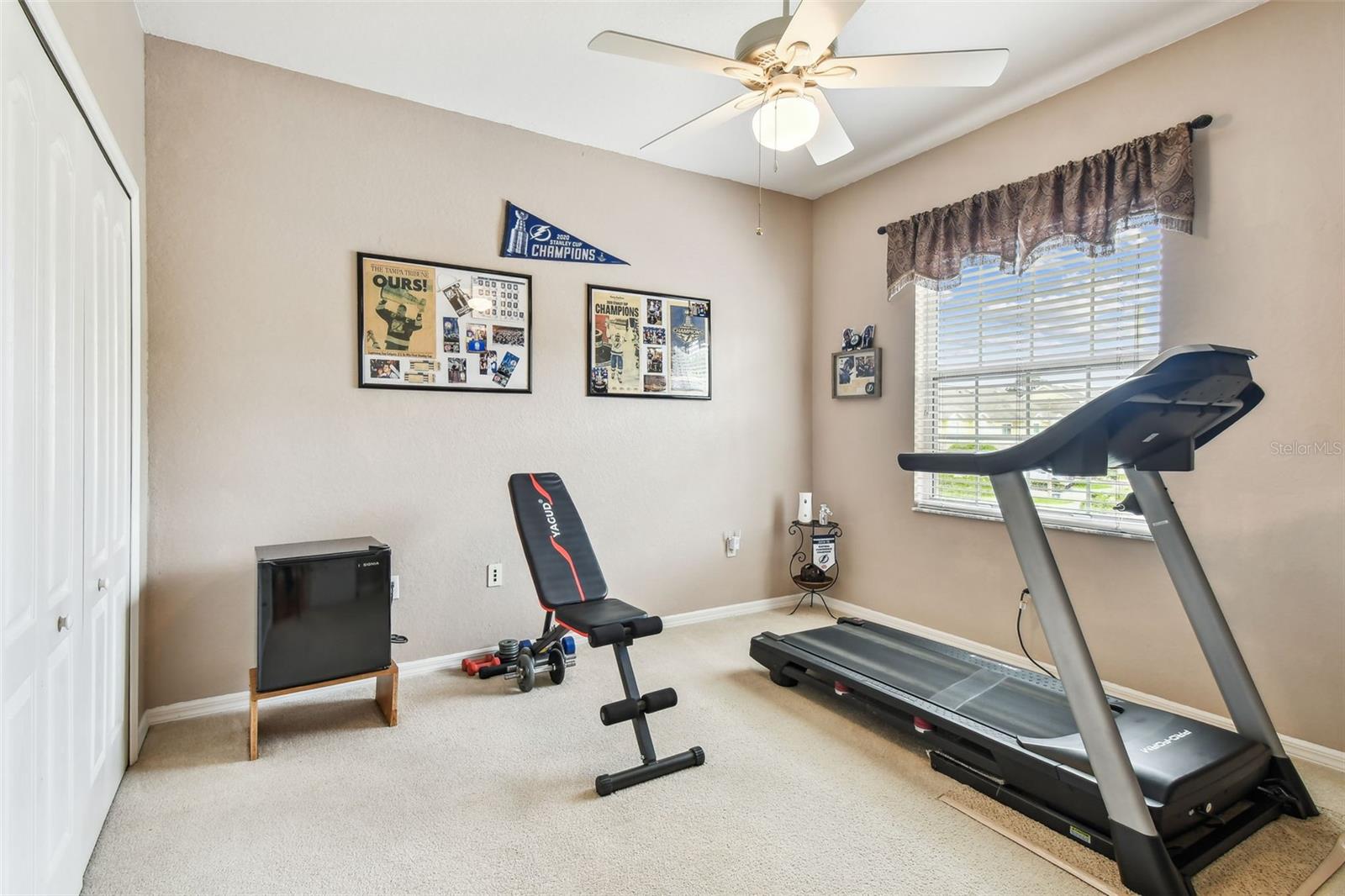Another bedroom currently being used as an exercise area.