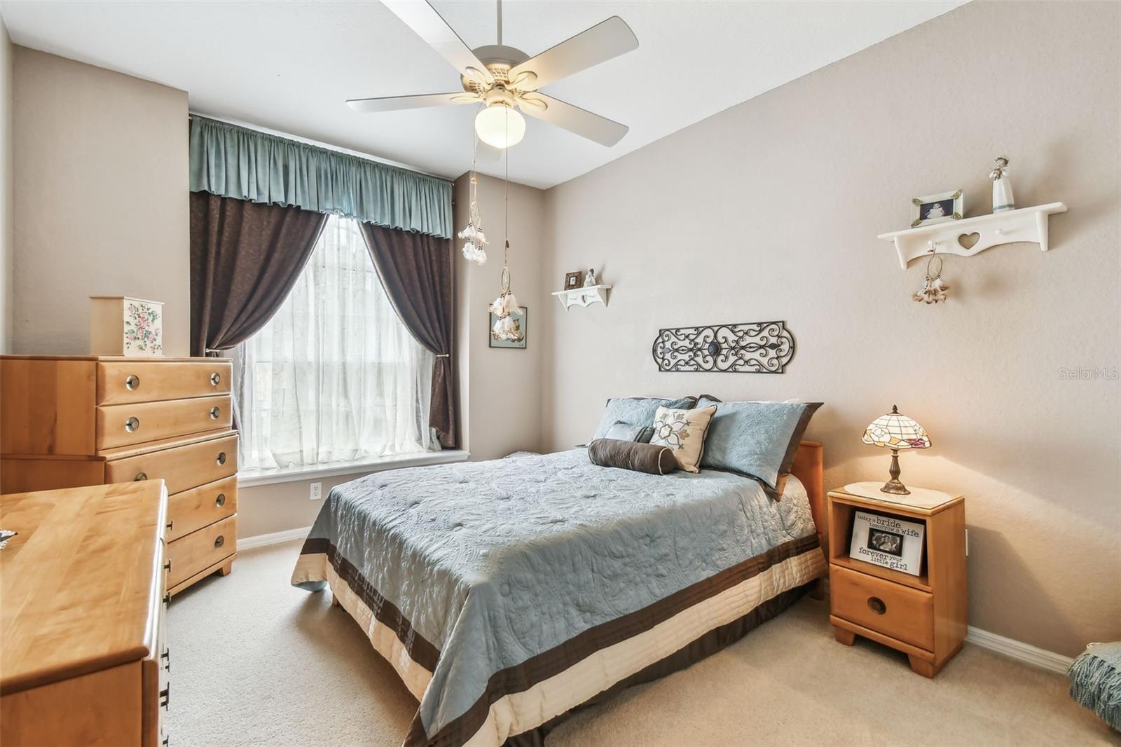 This sun filled bedroom is the perfect spot for guests.