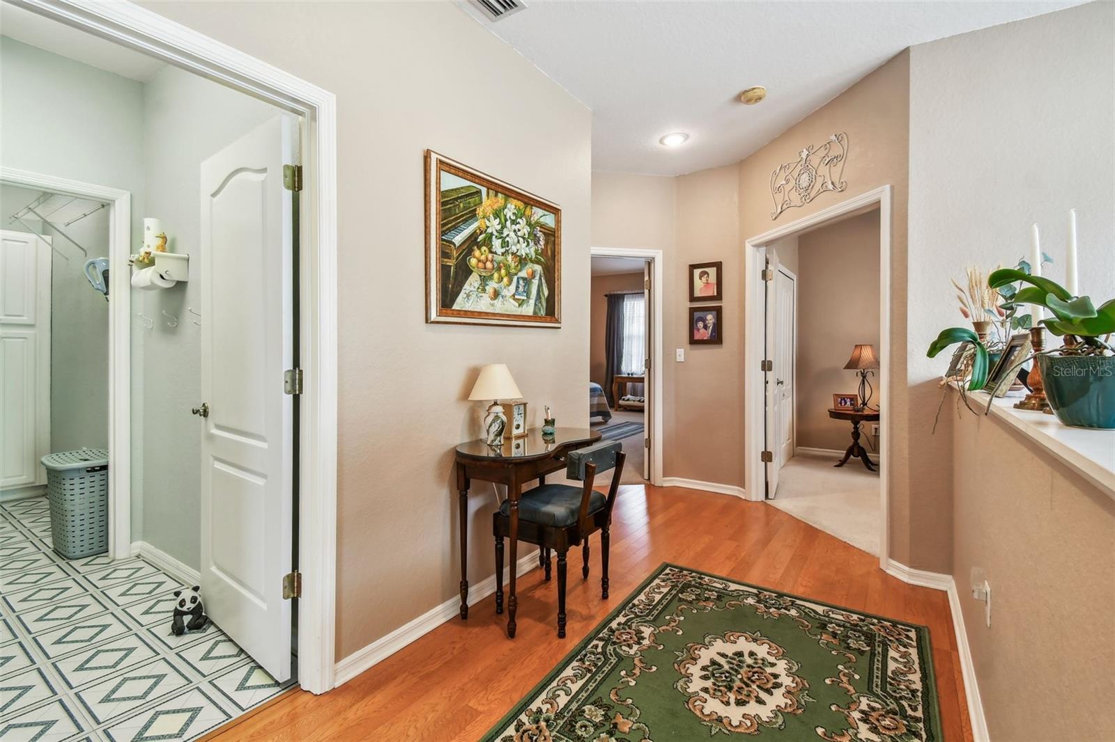 Second floor landing that leads to all the bedrooms and the laundry room.