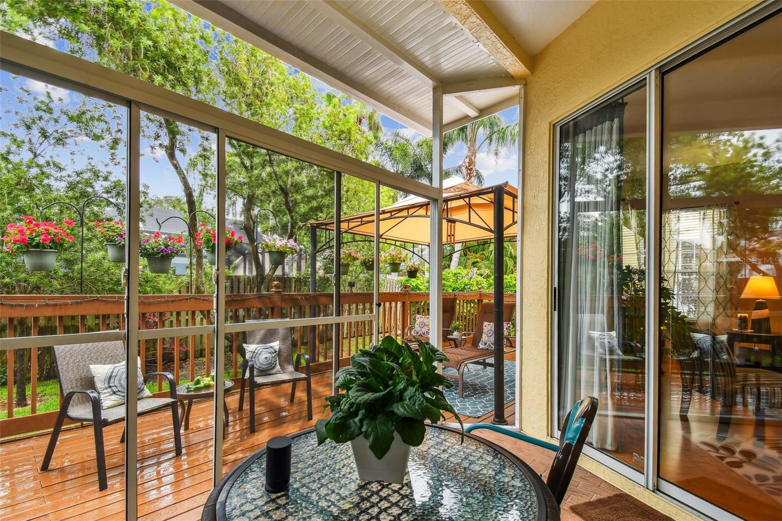 Open patio adjacent to screened in patio.