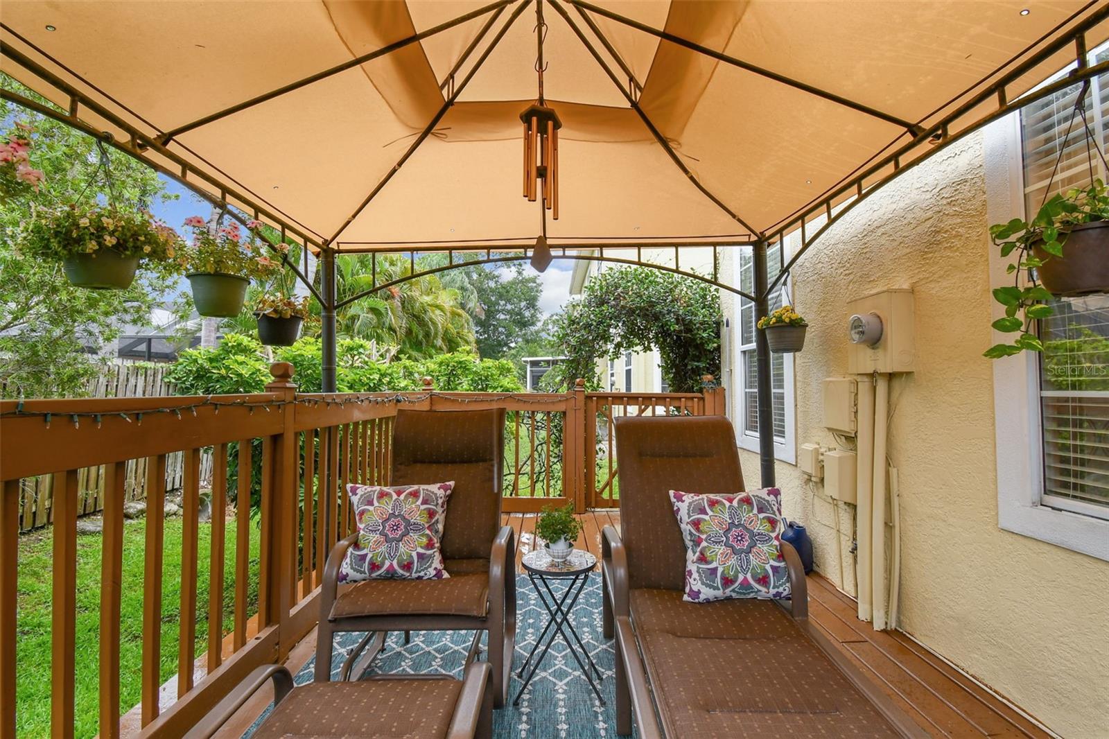 Seating area in open patio with covered canopy