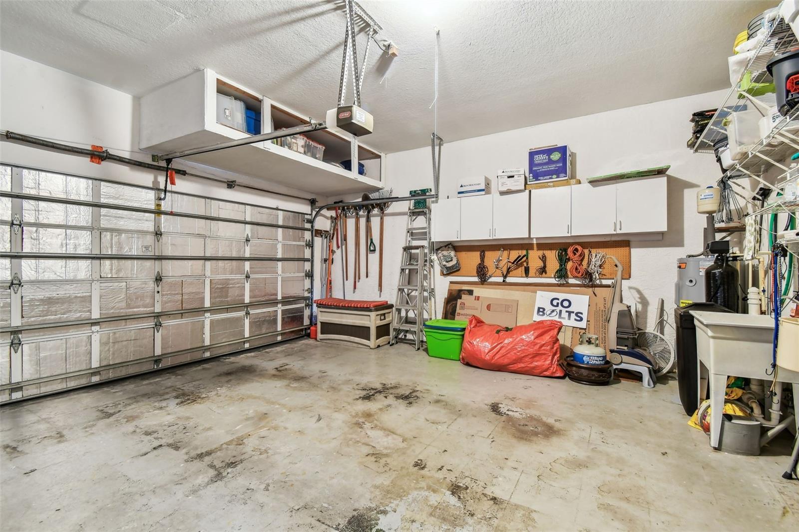 Garage with utility sink.