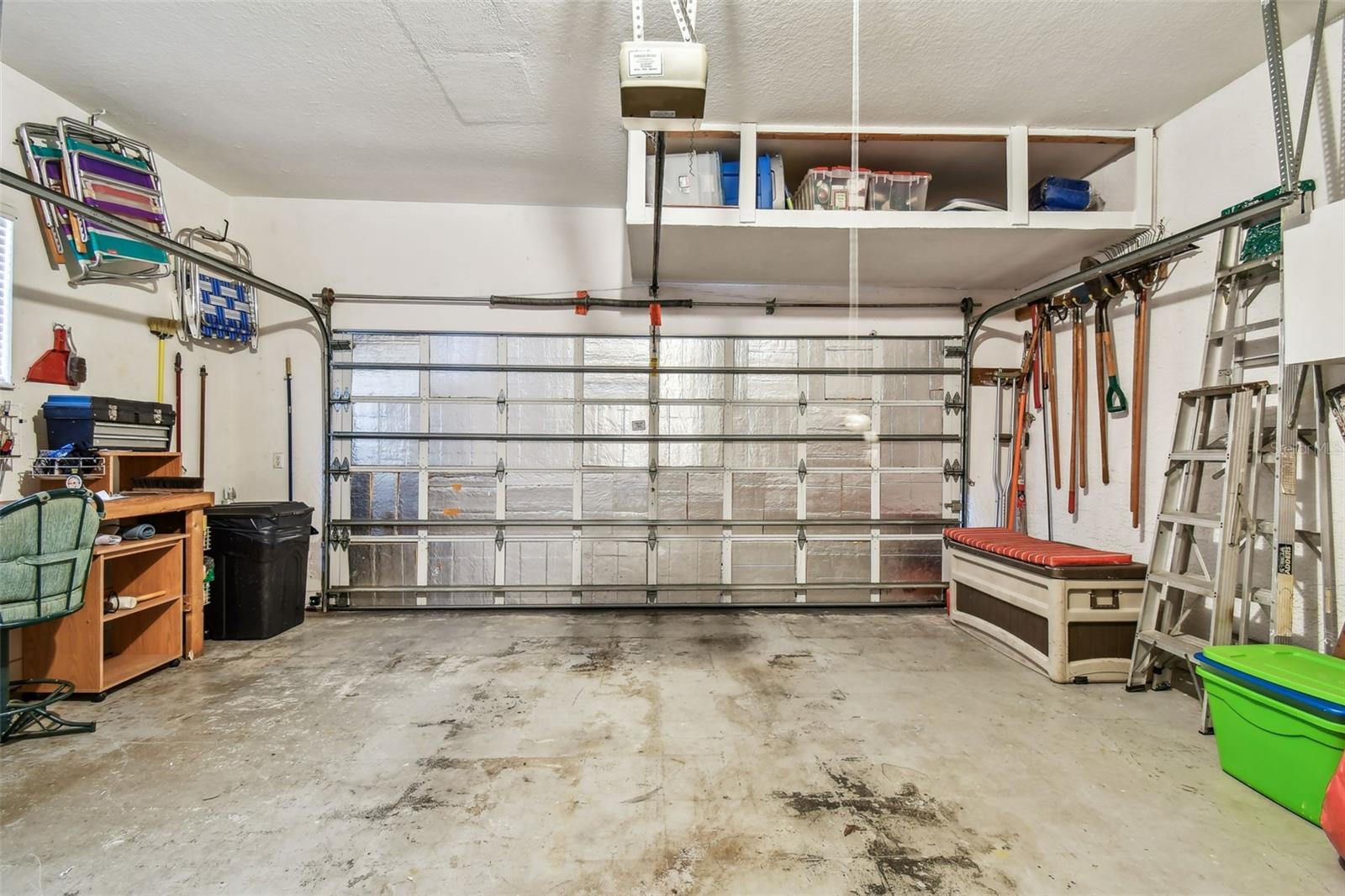 Garage with extra overhead storage.