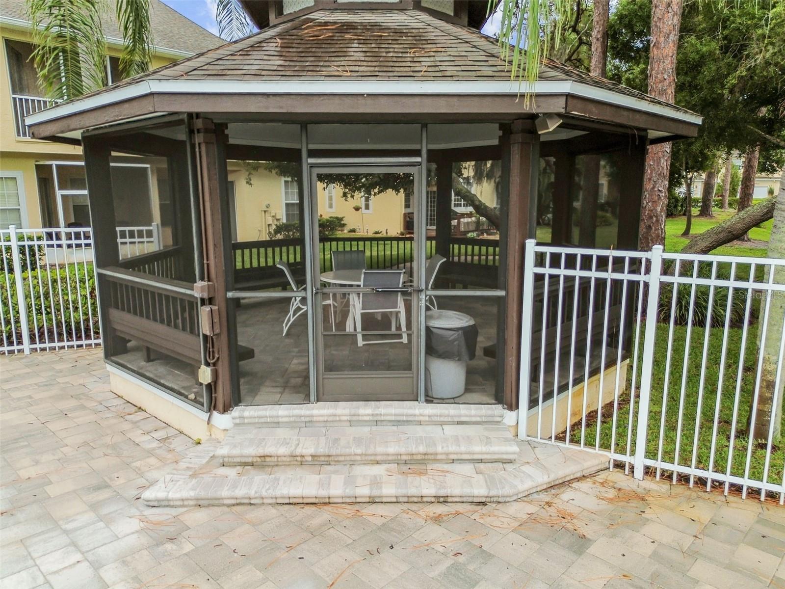 Sitting gazebo by the swimming pool.