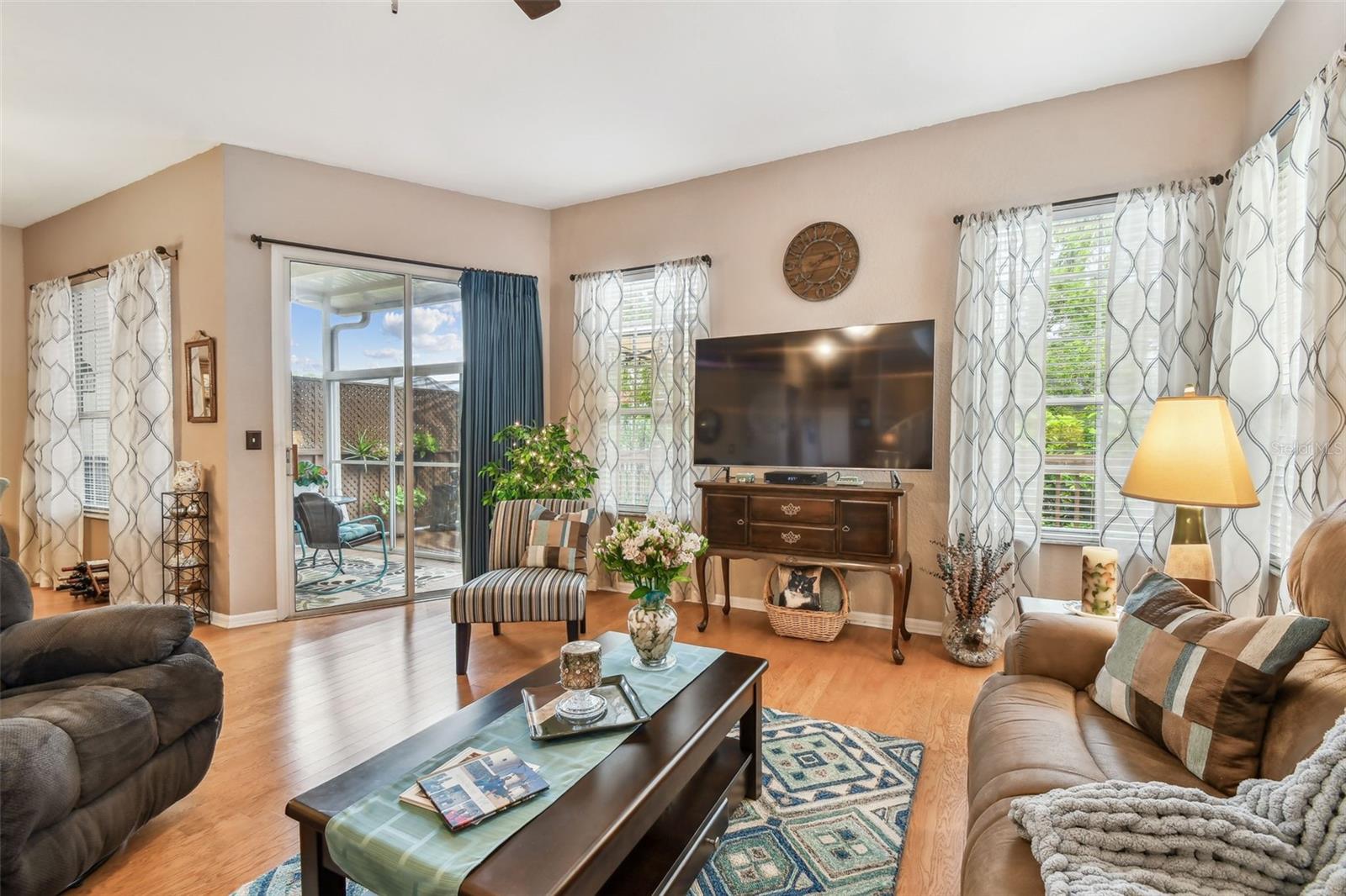 Living Room with view of screened in patio