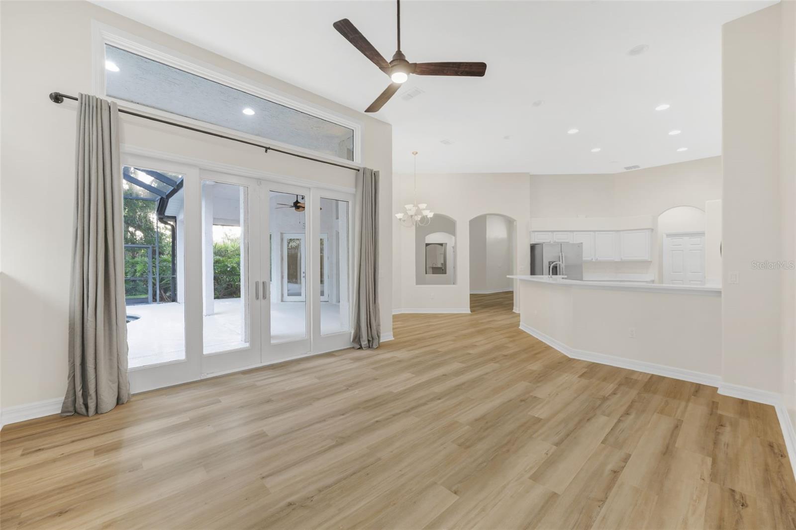 Family room with sliders to pool and lanai