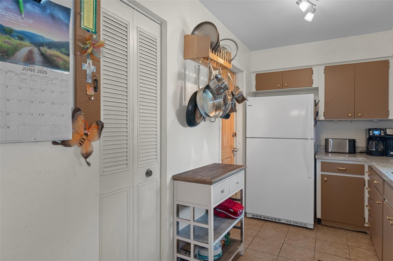Kitchen with Pantry and Tile Floor