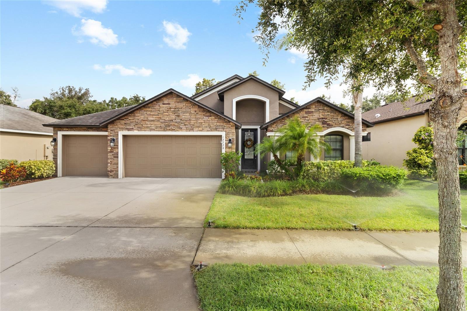 Beautiful full front stone accents add luxury to this 3- Car Garage 4 bedroom ranch home.
