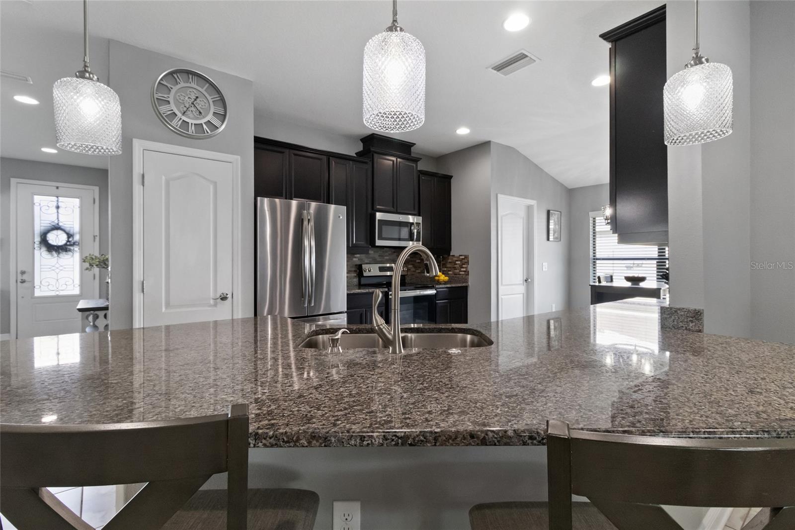 New stainless steel kitchen faucet professionally installed 2023.
