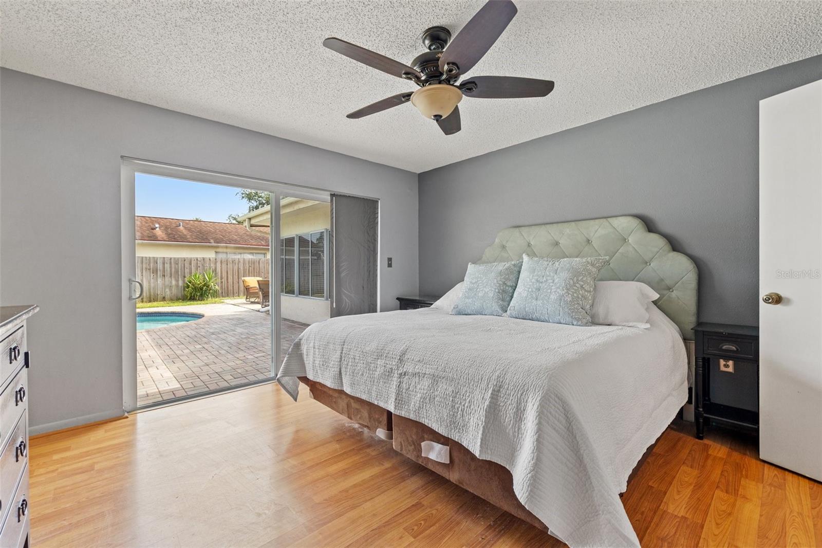 Primary Bedroom w/ slider to pool