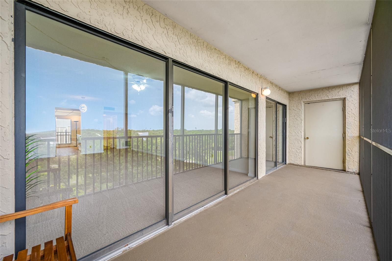 Lanai with sliding door access direct from living and primary bedroom with private laundry room