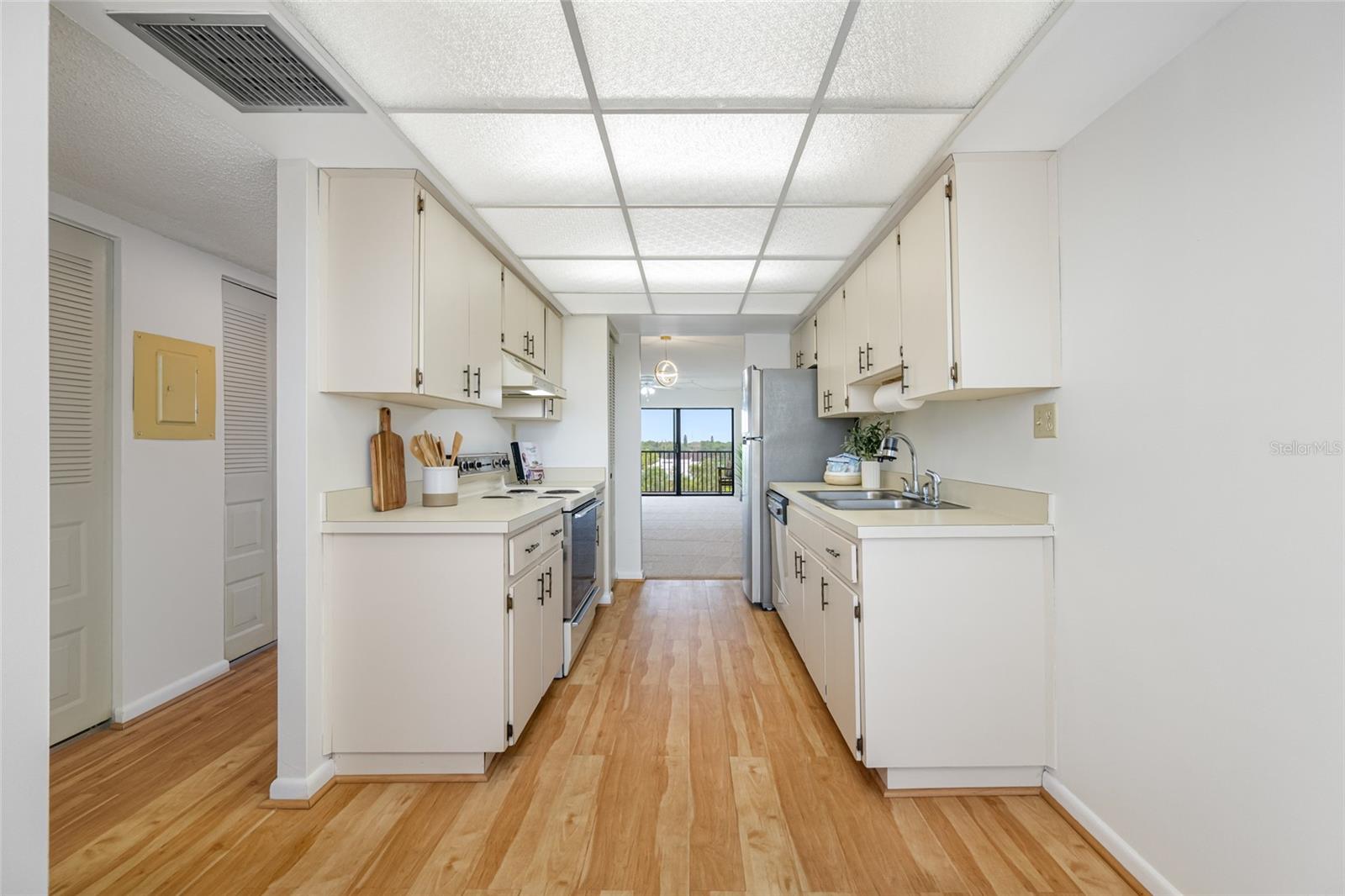 Kitchen with laminate plank style flooring