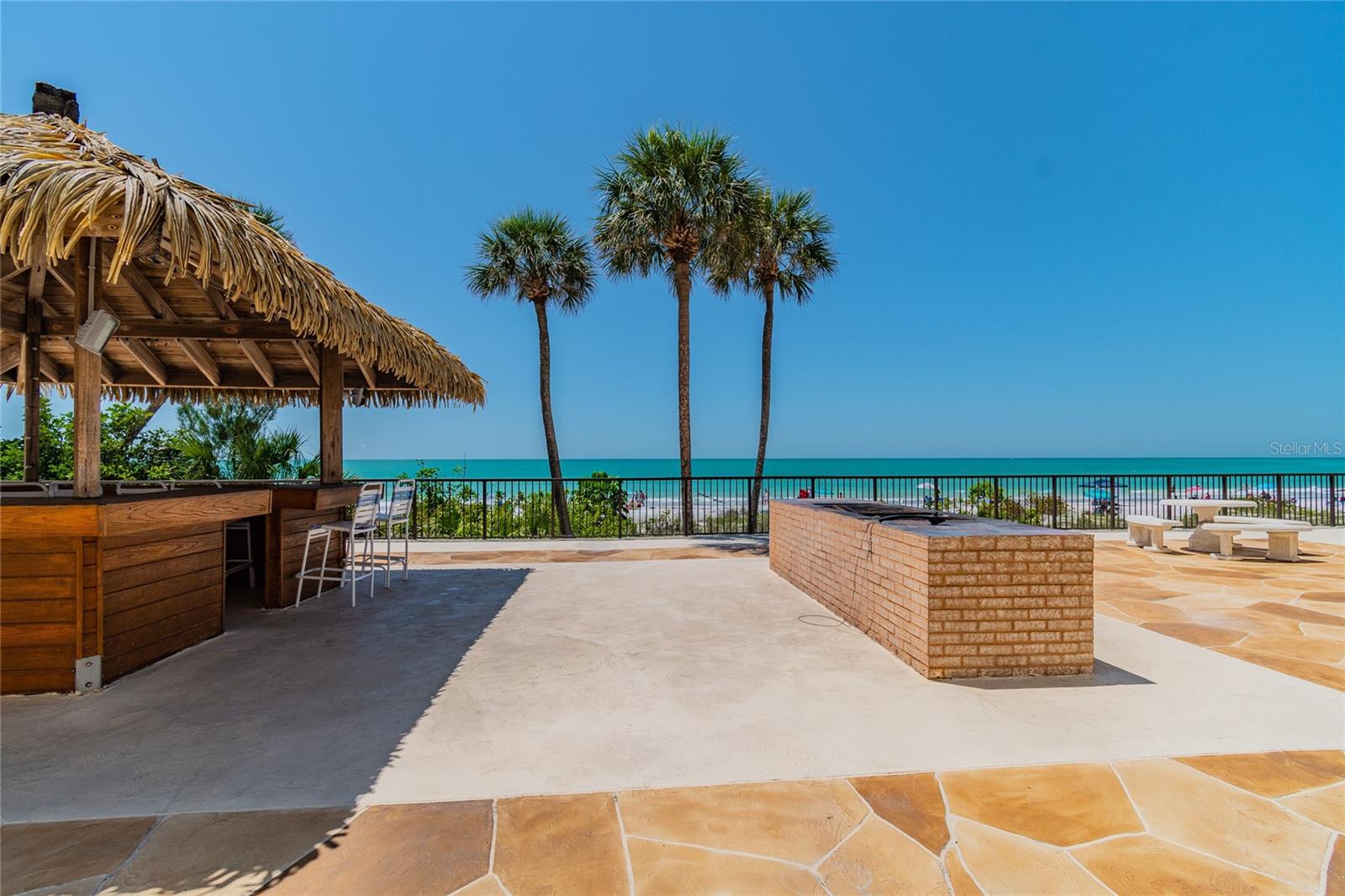 Grillin' & Chillin' at the BBQ and Tiki Hut with panoramic beach views!
