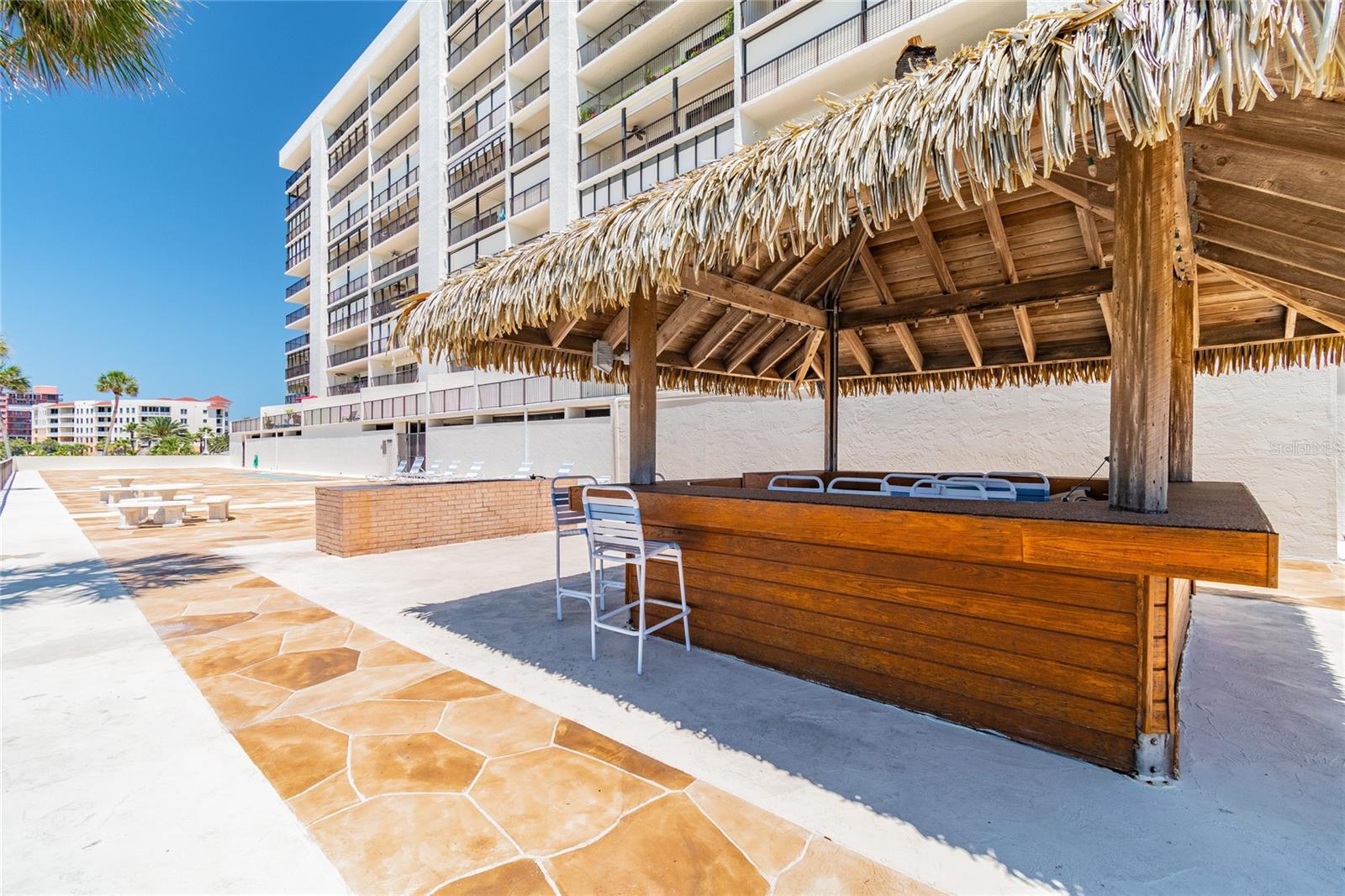 Grillin' & Chillin' at the BBQ and Tiki Hut with panoramic beach views!