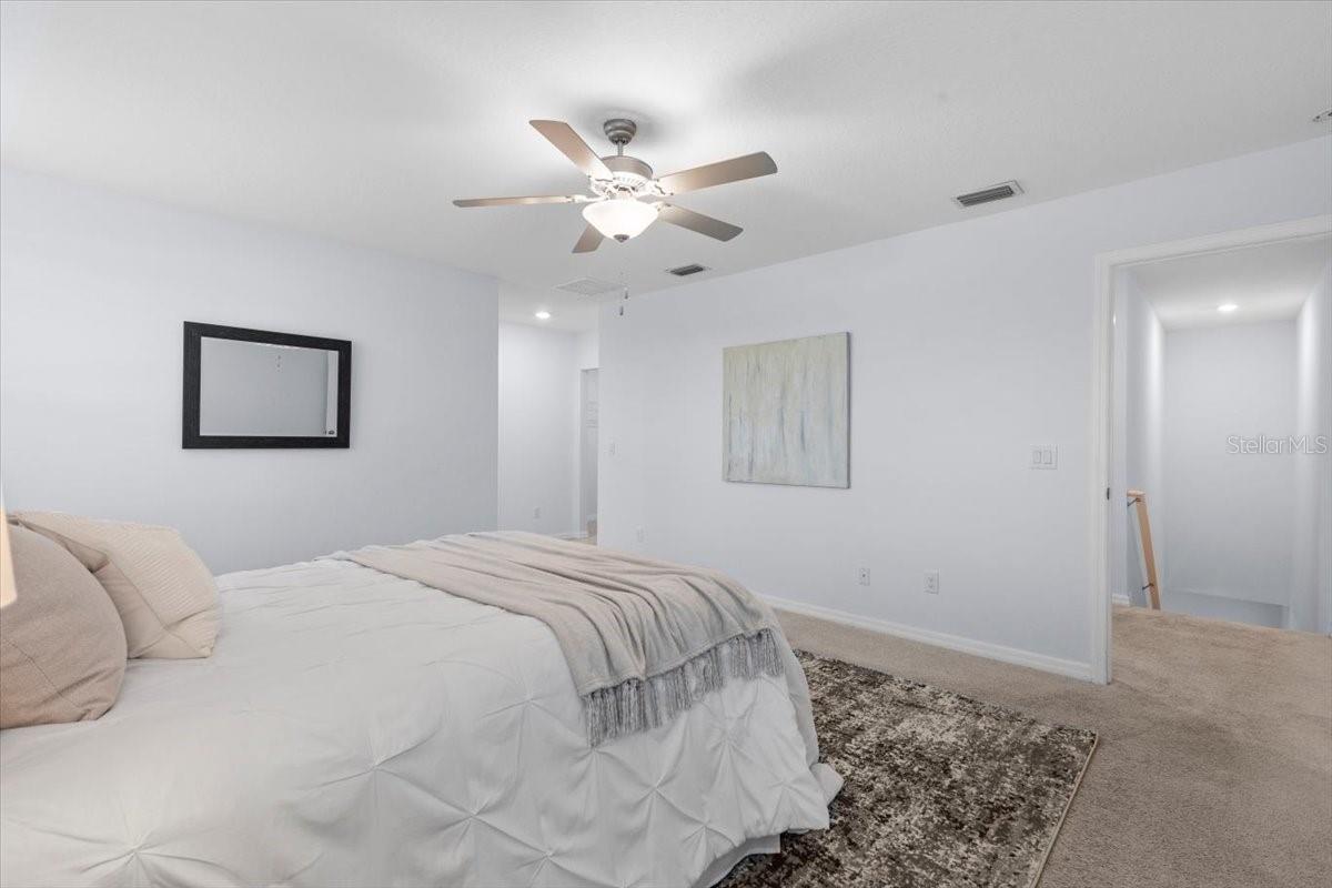 Spacious, light and comfy primary bedroom.