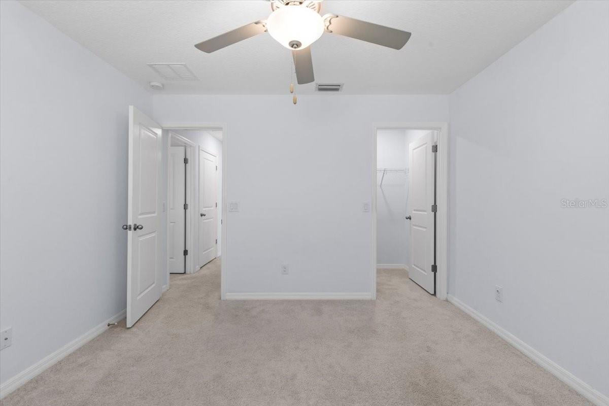 Guest bedroom with spacious walk-in closet!